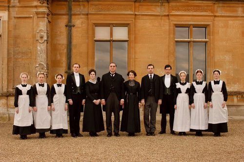 Image from Downton Abbey Season 1:: servants in front of Downton Abbey © Carnival Film & Television Limited 2010 for MASTERPIECE