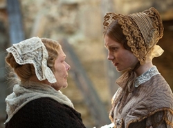 Mrs. Fairfax (Judi Dench) and Jane Eyre (Mia Wasikowska ) in Jane Eyre (2011)